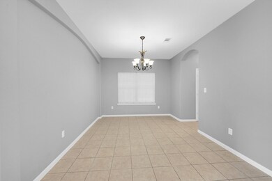 Nice large formal dinning room with tile flooring.