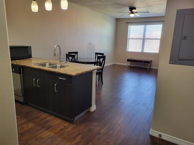 Kitchen featuring stainless steel dishwasher, sink