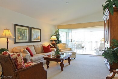 Living room featuring lofted ceiling and carpet fl
