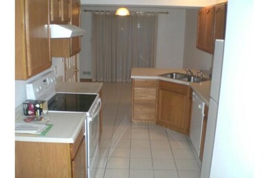 Kitchen. Beautiful oak cabinetry, vinyl floors, la