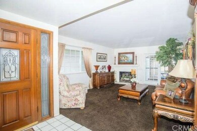 A gorgeous custom wood and antique glass door welcomes you inside to enjoy beautiful upgrades throughout this immaculate home.