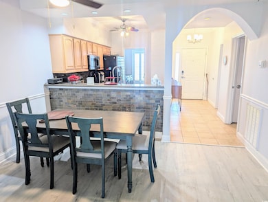 Dining room featuring baseboards, ceiling fan with