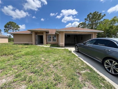 Front of house with its 2 car garage