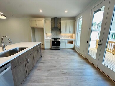 Open kitchen with deck off the rear is sure to be 