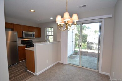 Dining room area to kitchen and sliding door to pa