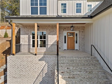 Doorway to property with board and batten siding a