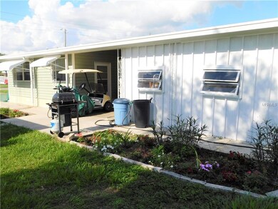 Side of home has nice garden area and work shop.