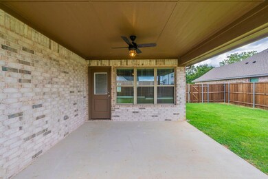 Covered brick patio, lighted farmhouse ceiling fan