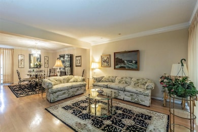 Large downstairs living area is open to the formal