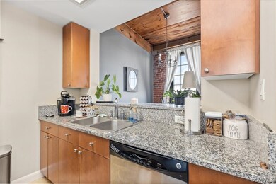 Kitchen featuring wood ceiling, hanging light fixt