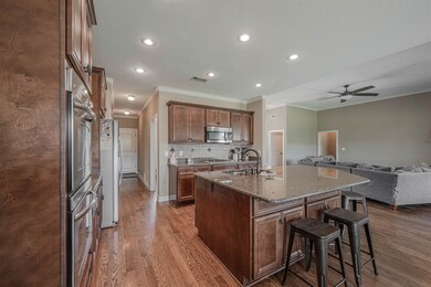 Kitchen featuring light stone countertops, ceiling