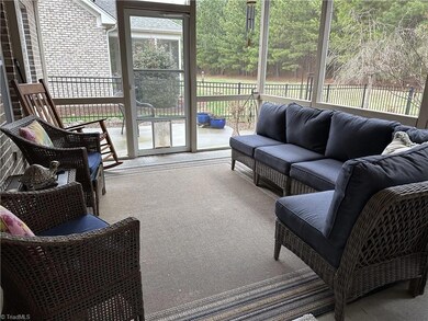 Screened Porch with Ceiling Fan, Leads to Patio