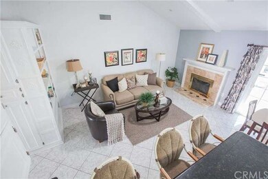 Family area with a fireplace & bookshelf. 