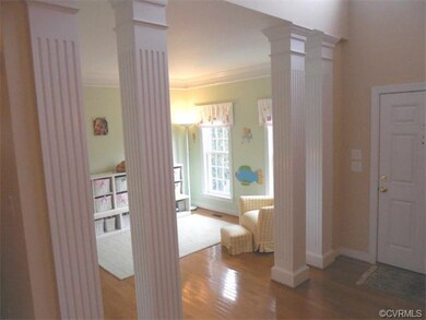 The 2-story Foyer is separated from the Living Roo