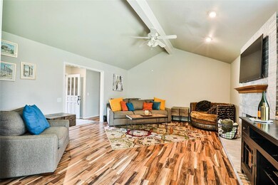 Living room with light hardwood / wood-style floor