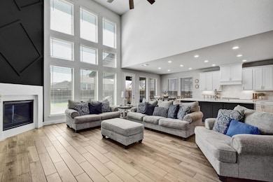The open floor plan connects the kitchen, dining, and family room, making it easy to spend time with family and friends.