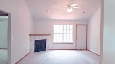 SPACIOUS living room with vaulted ceilings and fresh carpet