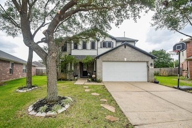 The house is surrounded by mature trees, providing
