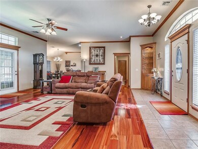 Hardwood floor continues down the hallway.  Hallwa