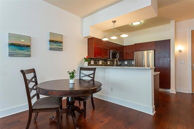 Kitchen featuring dark wood finished floors, deco