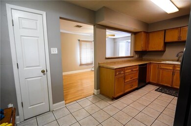Kitchen has a pantry and enough room for a nice si