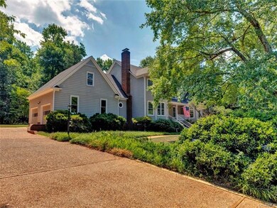 Front yard with view of 2 car side load garage.