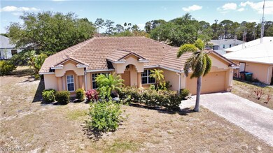 Mediterranean / spanish home with a tiled roof, an