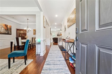 Entrance foyer featuring dark hardwood / wood-styl