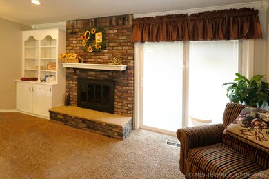 Large living area with sliding doors to backyard p