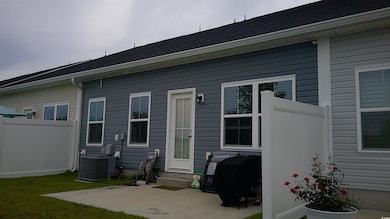 Rear view of house with a patio area and central a