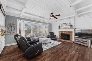The great room has another stunning coffered 9' ce