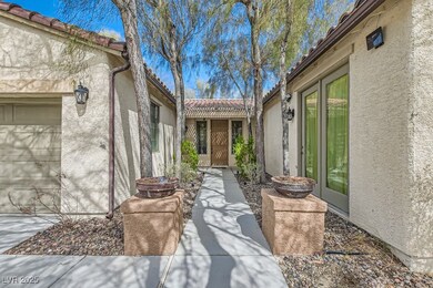 Entrance to property with a tiled roof and stucco siding