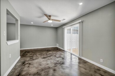 Spare room featuring finished concrete flooring, 