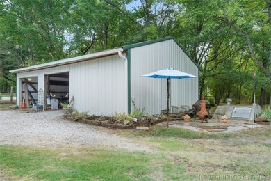 Two car garage and workshop provide ample space fo