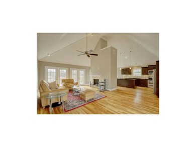 The Great Room is DRAMATIC with soaring ceilings, 