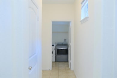 Hall with light tile patterned flooring and washi
