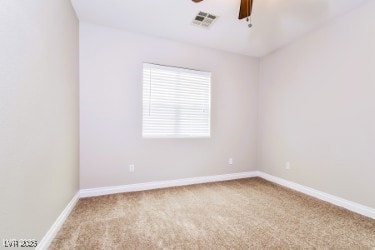 Empty room with carpet and ceiling fan
