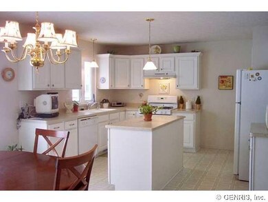 Kitchen. Wonderful white kitchen with island, appl