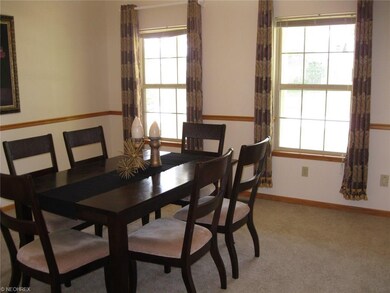 Formal dining room has chair-rail.
