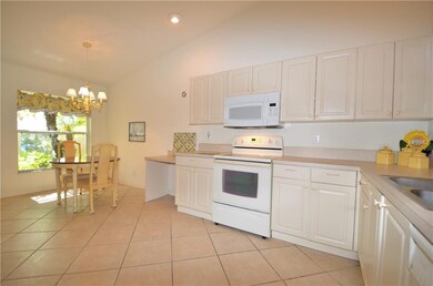 Kitchen features raised panel cabinetry, Formica c