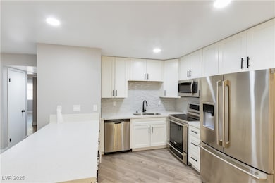 Kitchen featuring light wood-style flooring, light