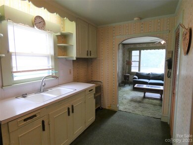 Kitchen looking into den