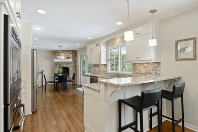 Fantastic remodel with shaker cabinets, glass fron