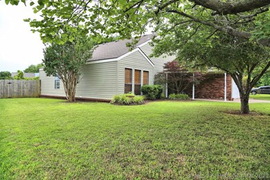 The crepe myrtle on the side of the house is stunn