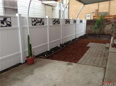 New vinyl fence featuring black decorative panels 
