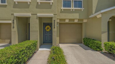 Unit 9008 front entry door and tandem garage on the right.