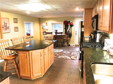 Large island with matching swivel chairs that will