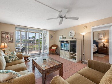 Living area with tile patterned floors, baseboards