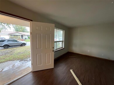 Doorway with dark wood-type flooring and lofted ce