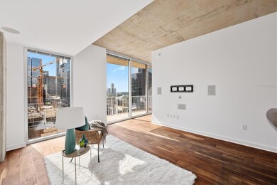 Living area with a wall of windows, wood finished